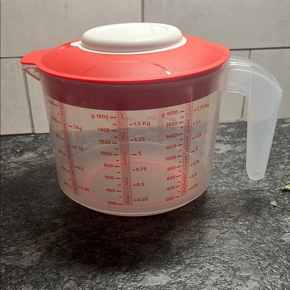 Tupperware Mix n Store Red and White Measuring cup. New without tags